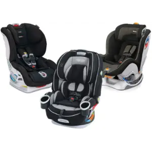 A convertible car seat with a black base and a red and gray patterned fabric infant insert. The car seat is facing forward and the harness straps are visible.